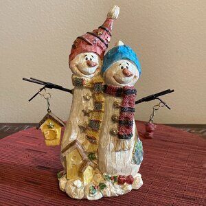 Lovable Snow Couple Holding a Birdhouse & Bird